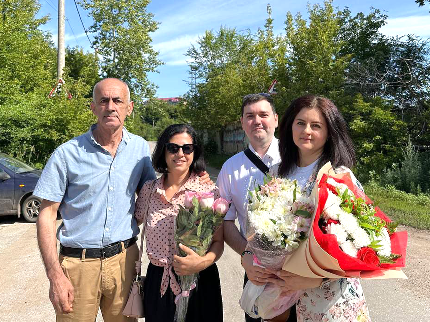  Left to right: Sona’s father and sister, along with her husband, pose for a photo with her following her release. July 2025